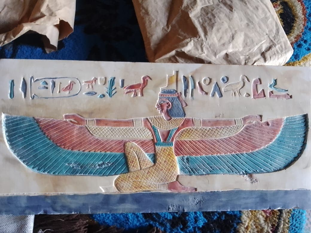 ancient egypt stone panel carving with hieroglyphics
