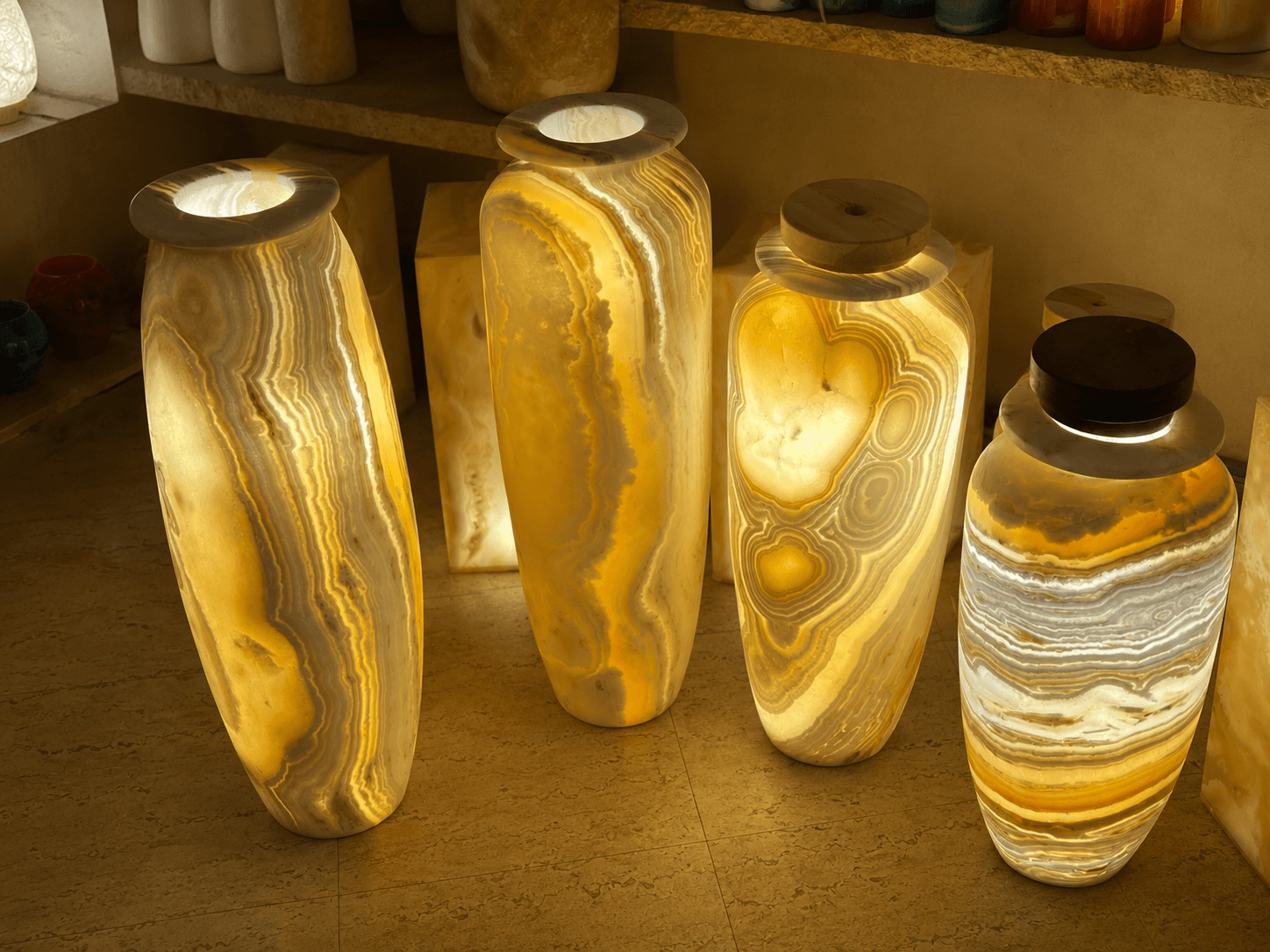 Slender tall classic alabaster stone vase showcasing intricate natural grain